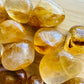 Natural light view of a single Golden Healer tumbled stone from Brazil.