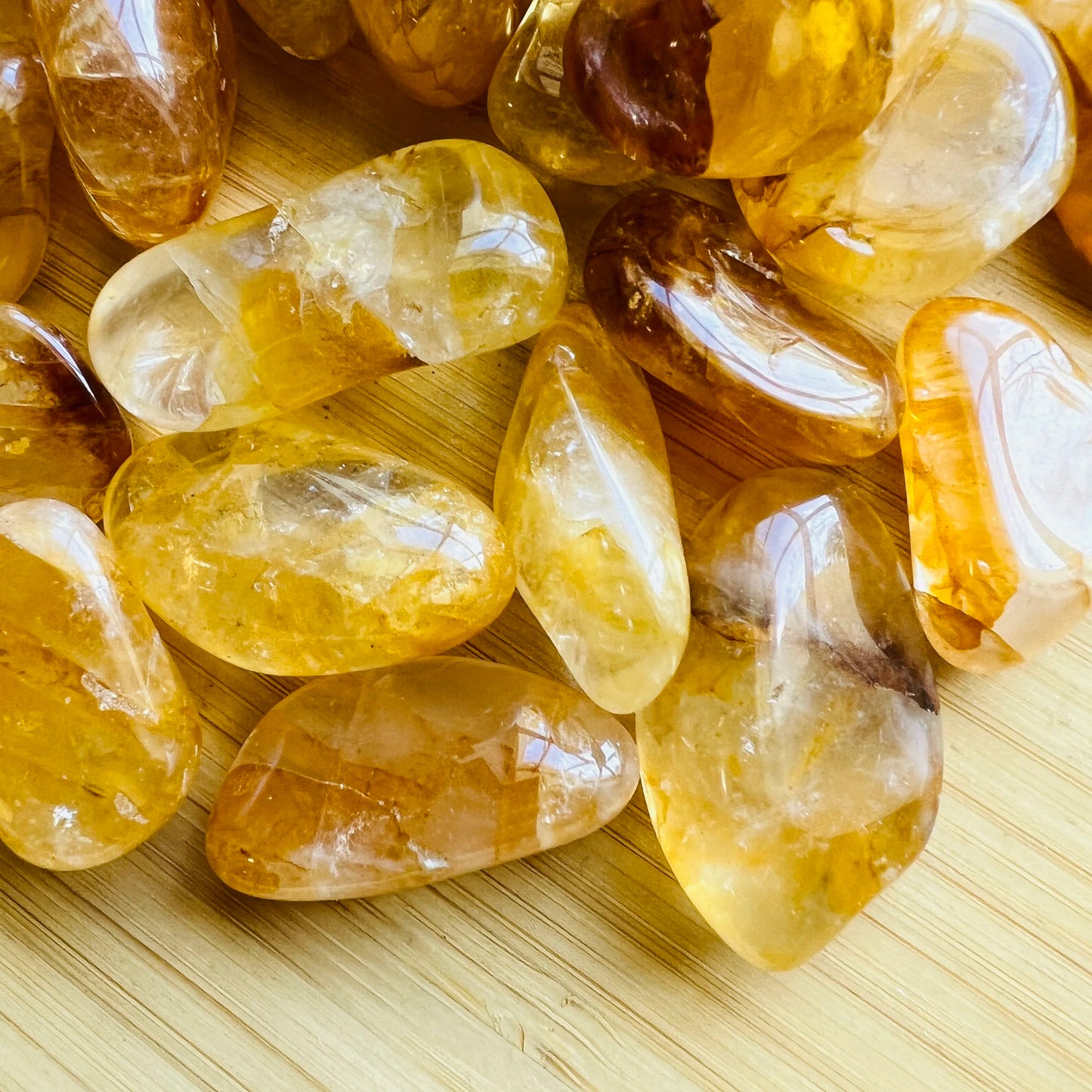 Detail shot of Grade AAA Golden Healer tumbled stone under natural light
