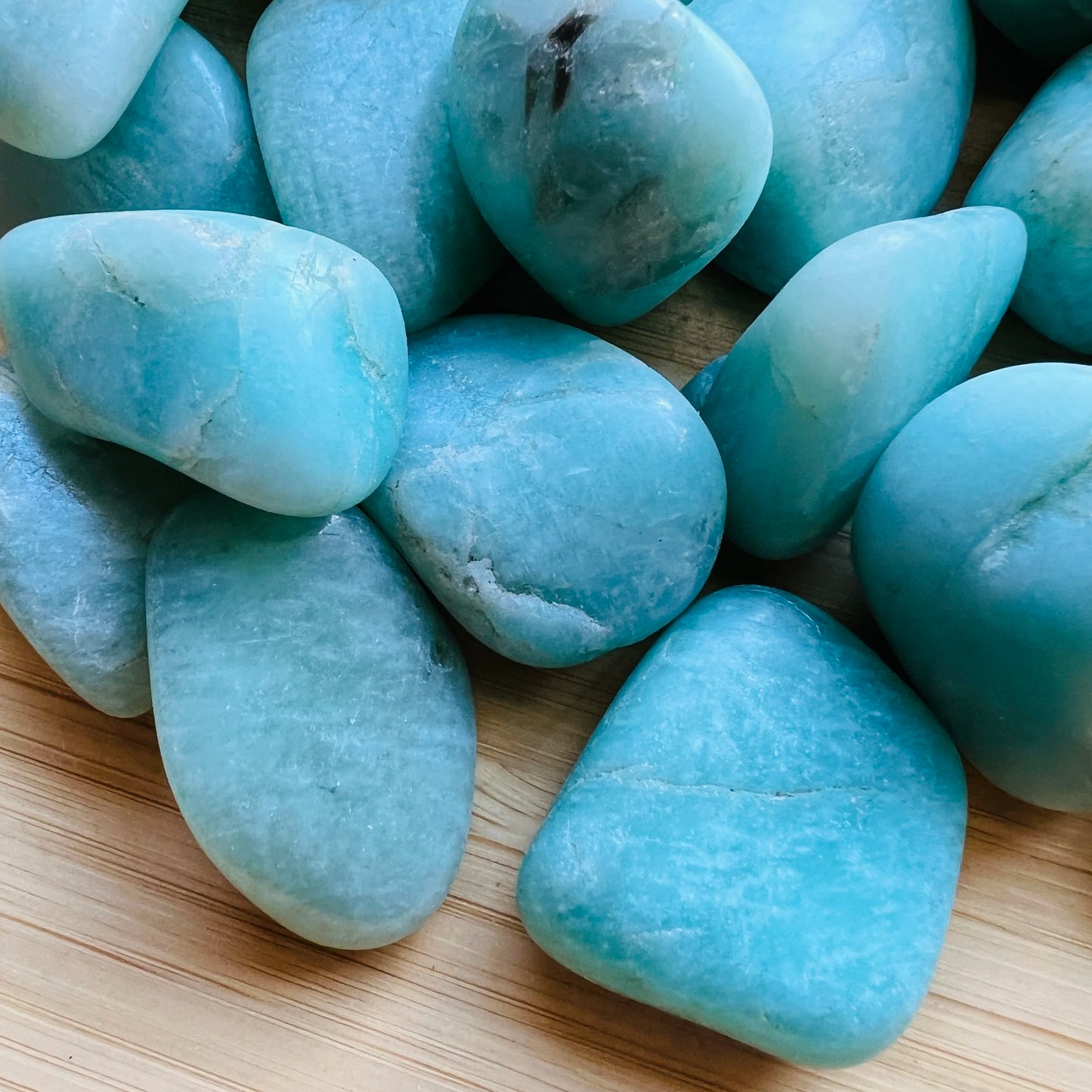 Bird's-eye view of Amazonite tumbled stone, linked to Stress Relief and Emotional Healing.