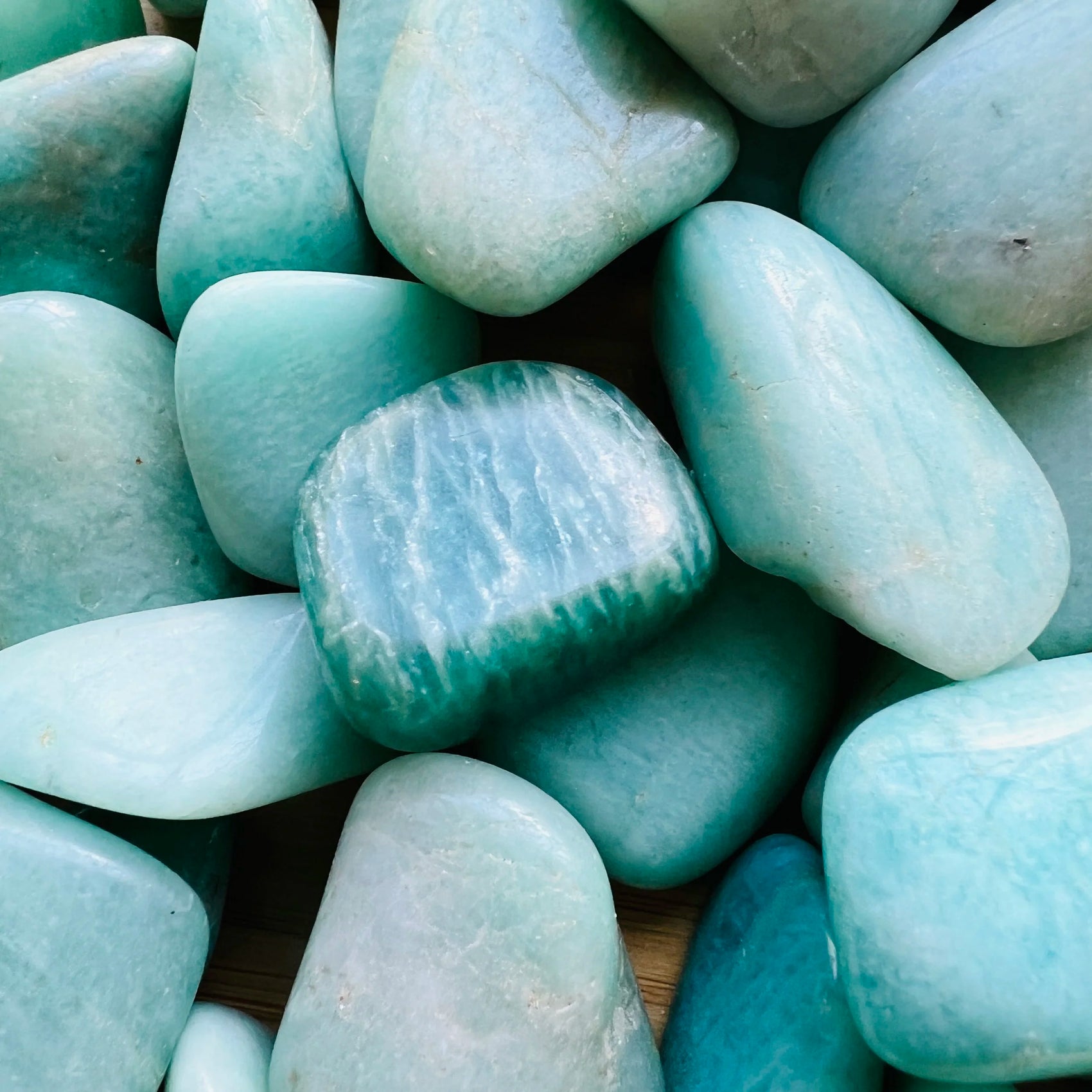 Close-up of Amazonite tumbled stone from Brazil, soothing wellness stone for Emotional Healing