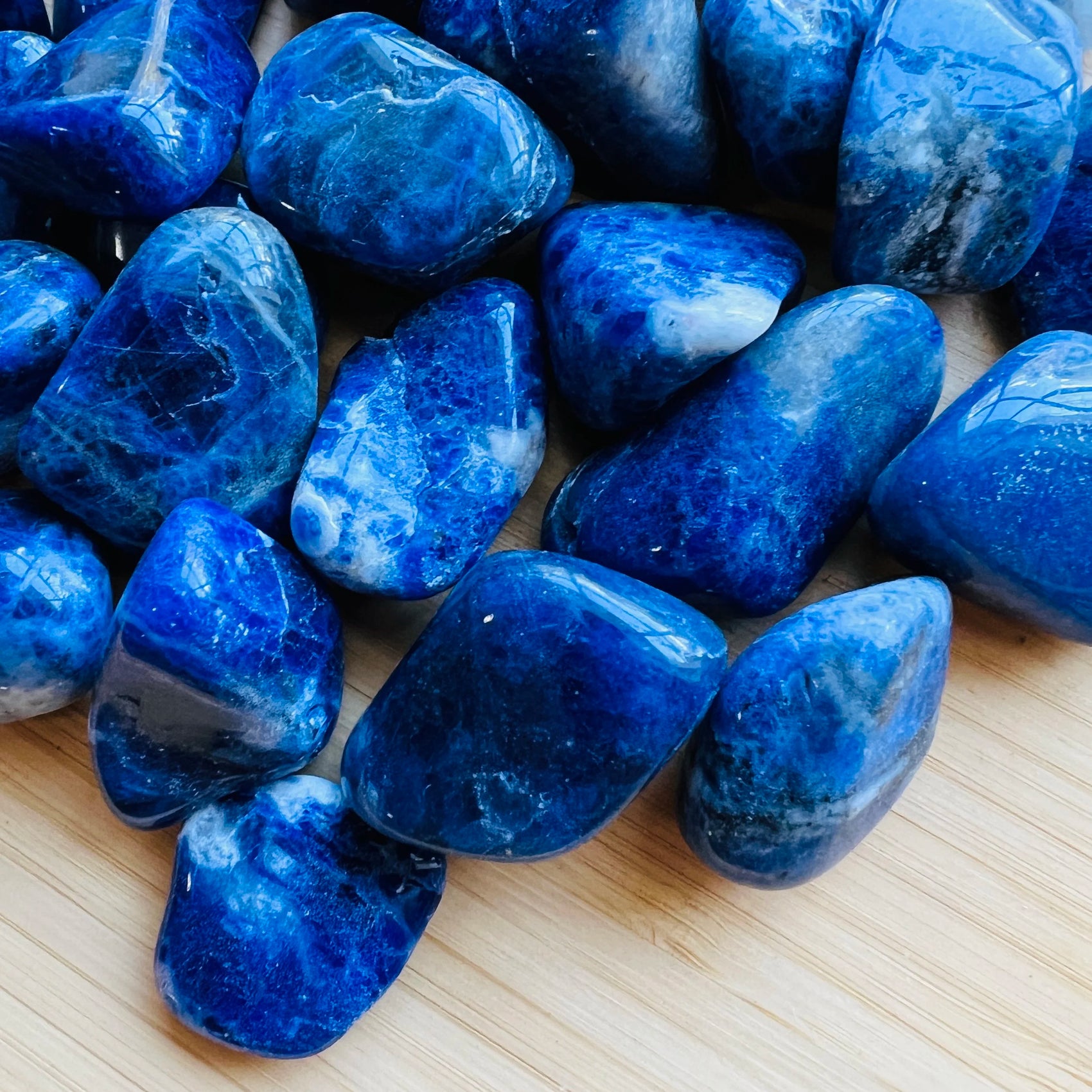Surface detail of Sodalite tumbled stone, showing subtle veining, from Bahia, Brazil.