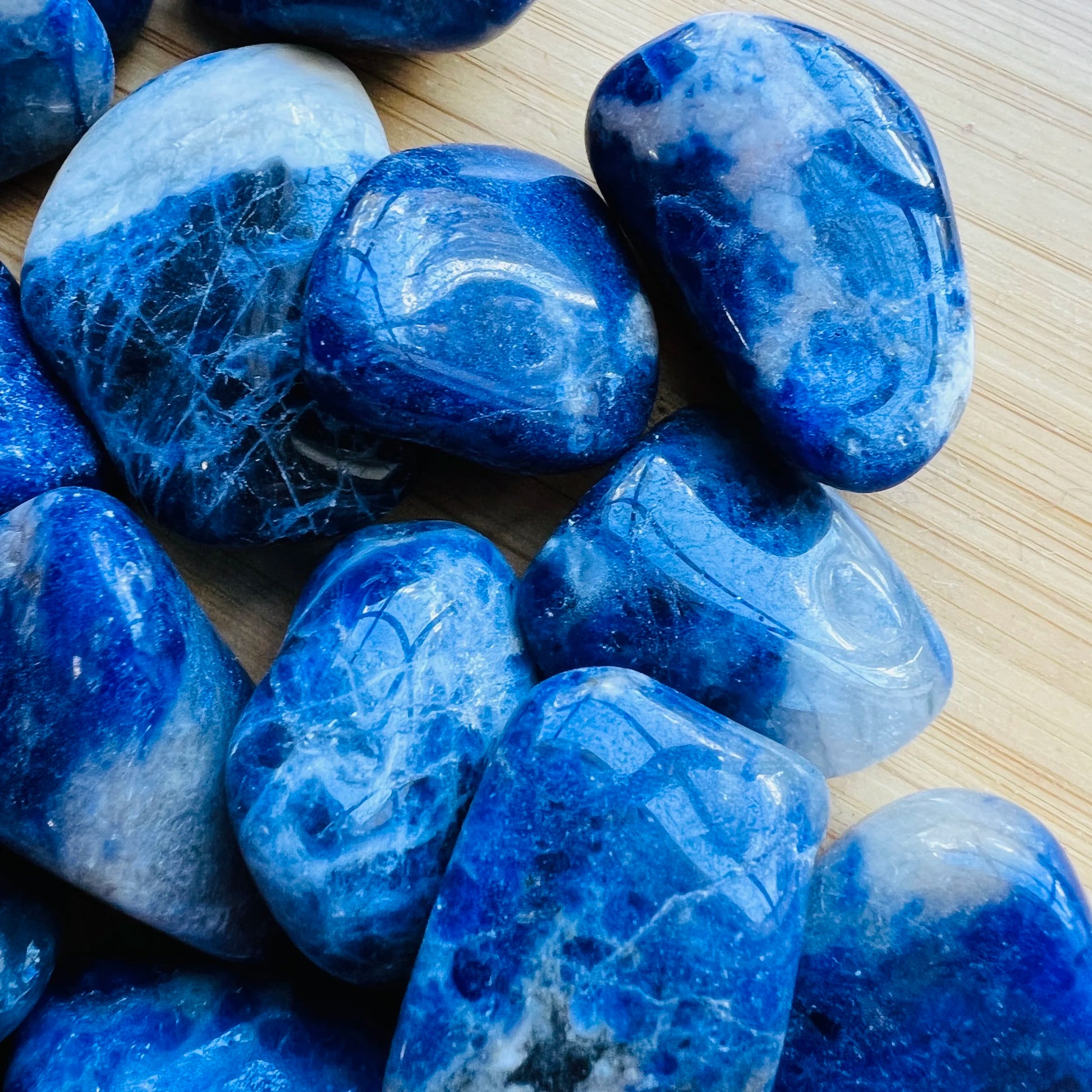 Hand-scale shot of a Sodalite tumbled stone, sourced from Brazil.