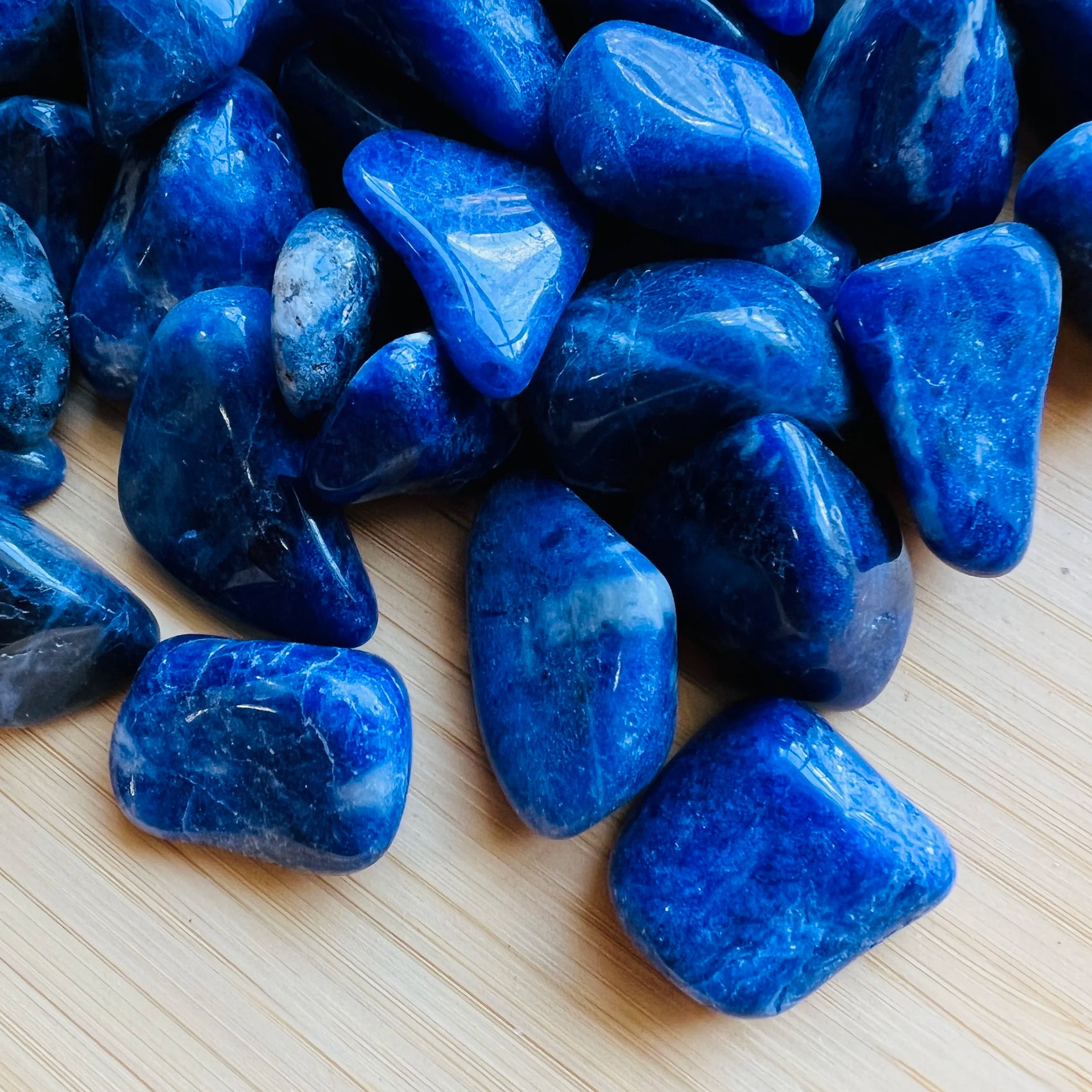 Grain detail of Sodalite tumbled stone, showing earthy tone.
