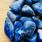 Bird's-eye view of Sodalite tumbled stone, showing subtle veining, hand-selected from Bahia, Brazil.