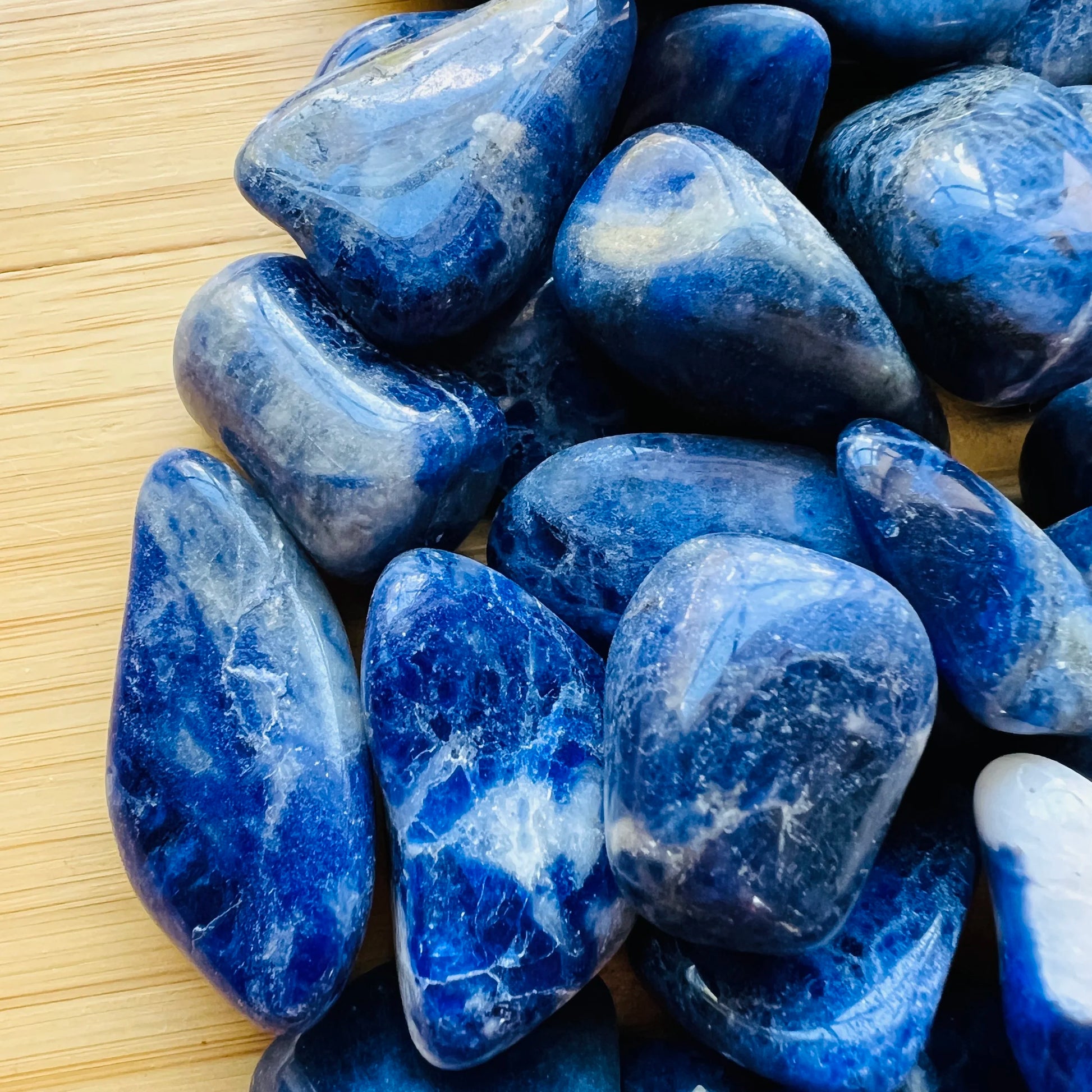 Bird's-eye view of Sodalite tumbled stone, showing subtle veining, hand-selected from Bahia, Brazil.