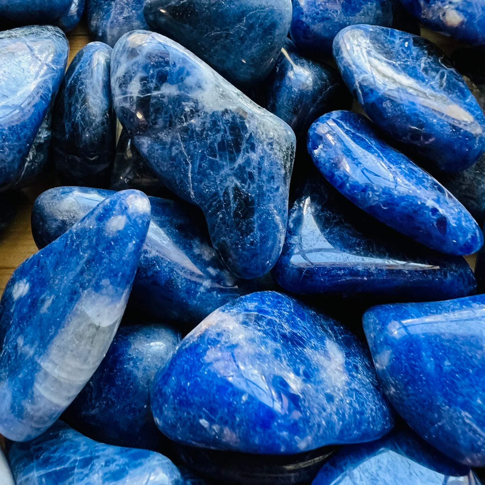 Underside detail of Sodalite tumbled stone, showing characteristic color.