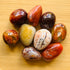 Ethically sourced Grade AA Carnelian palm stone from Boeny, Madagascar at Beyond Bohemian