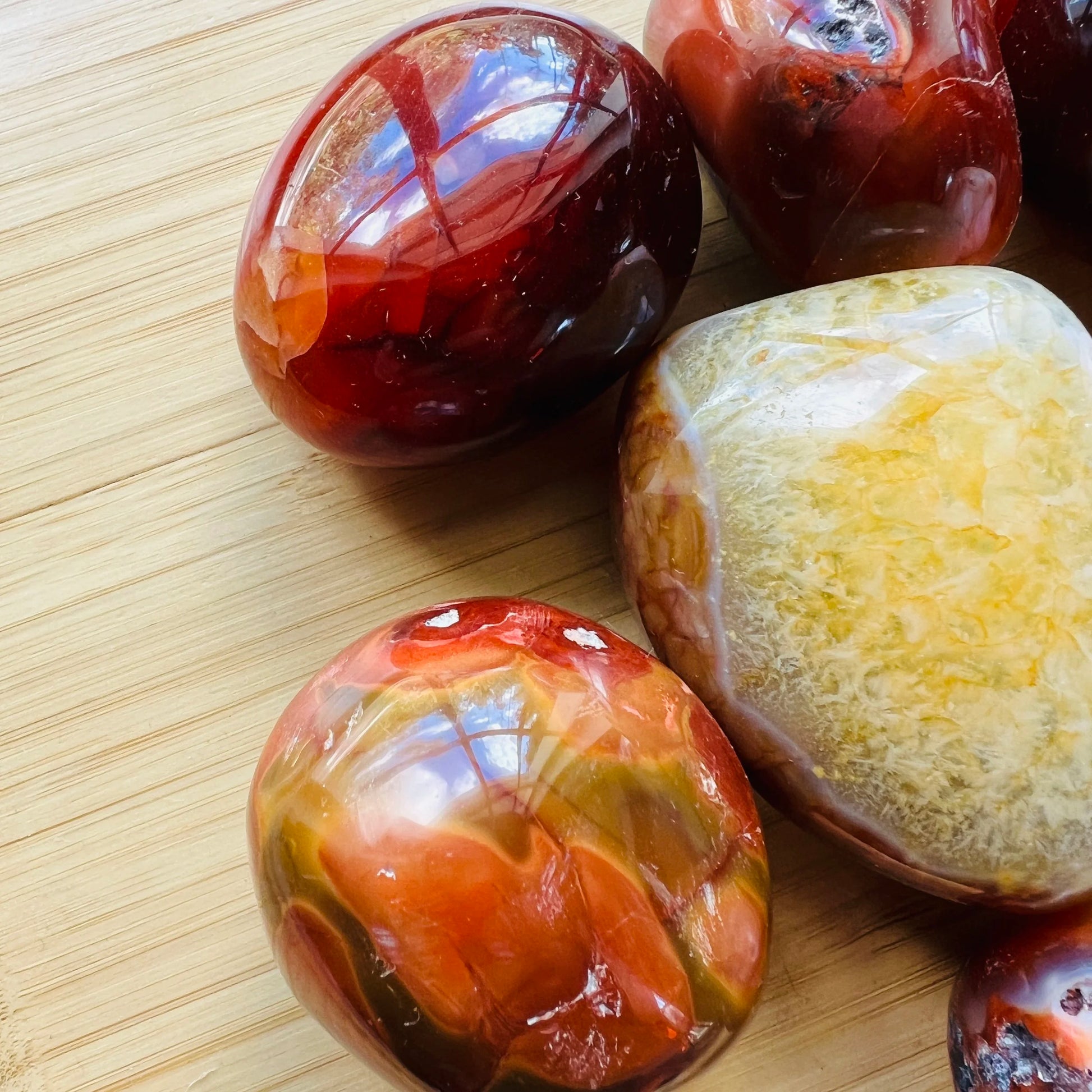 Top view of Grade AA Carnelian palm stone, sourced from Boeny, Madagascar