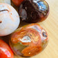 Alternate angle of Grade AA Carnelian palm stone showing overall shape