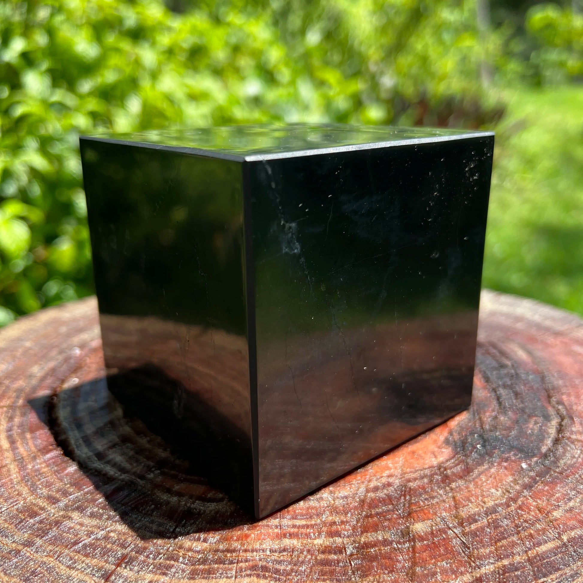Bottom side of Shungite polished cube, showing matte finish, Russia-sourced.