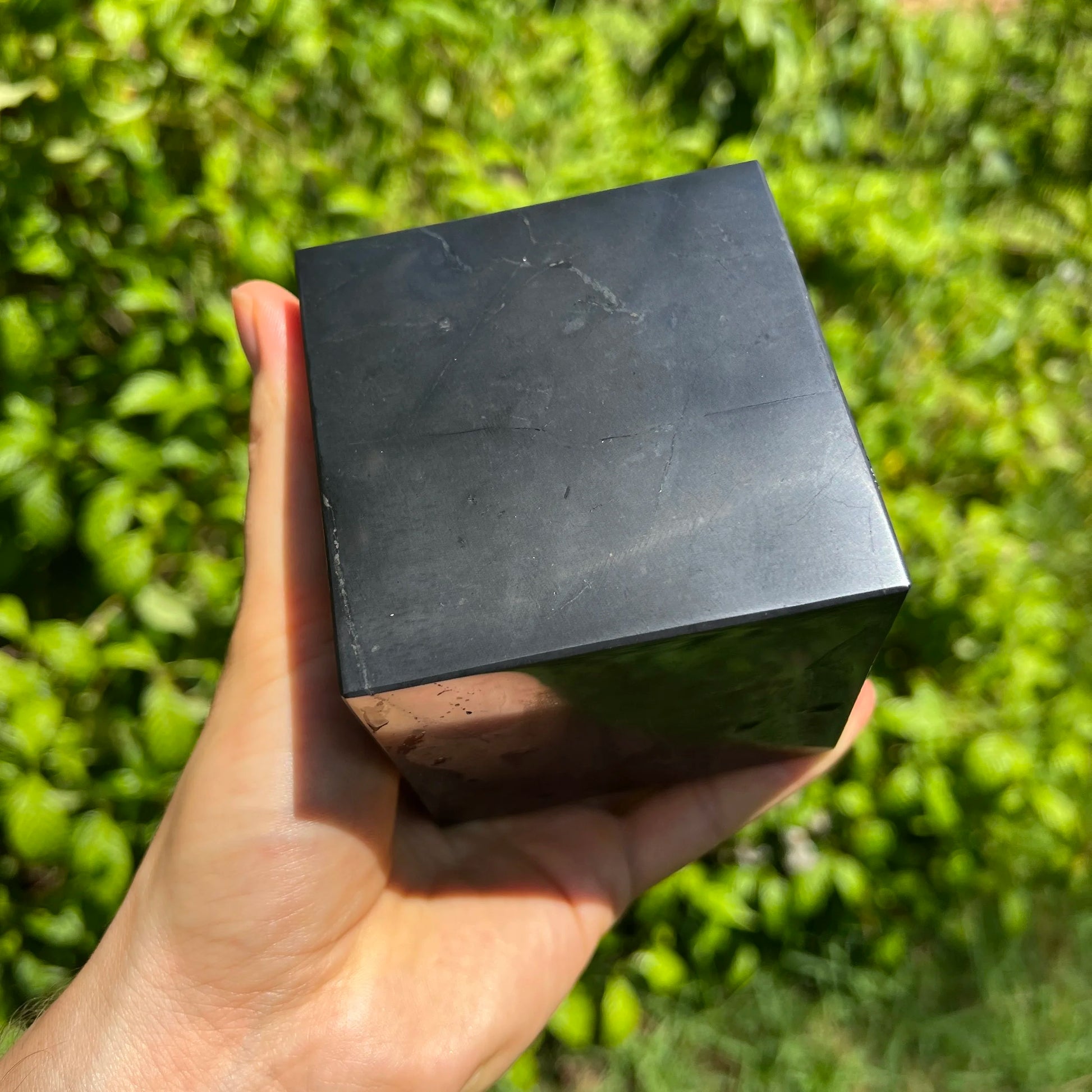 Back view of Grade Type III - Regular Grade Shungite polished crystals & decor showing natural surface
