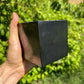 Detail shot of Grade Type III - Regular Grade Shungite polished crystals & decor under natural light