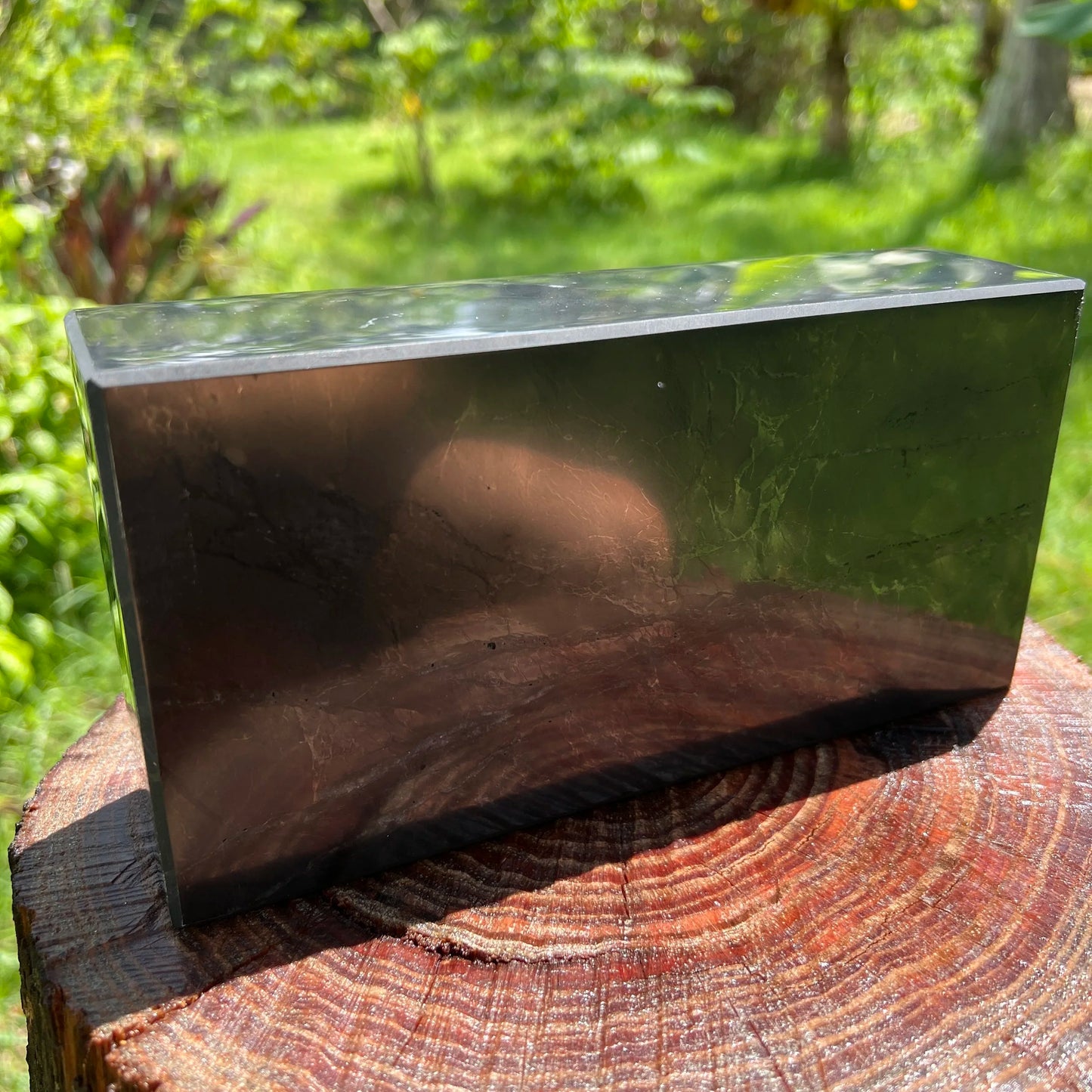 Close-up of Shungite polished block, showing color depth, turned to for Protection and Cleansing.