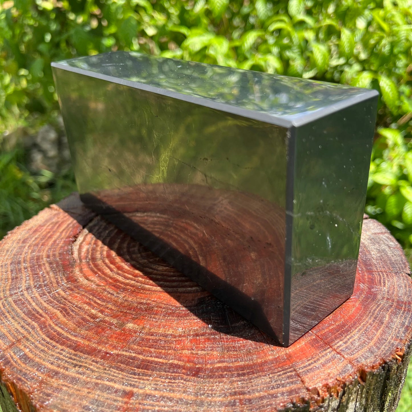 Edge-on view of Shungite polished block, from Republic of Karélia, Russia, showing natural variation.