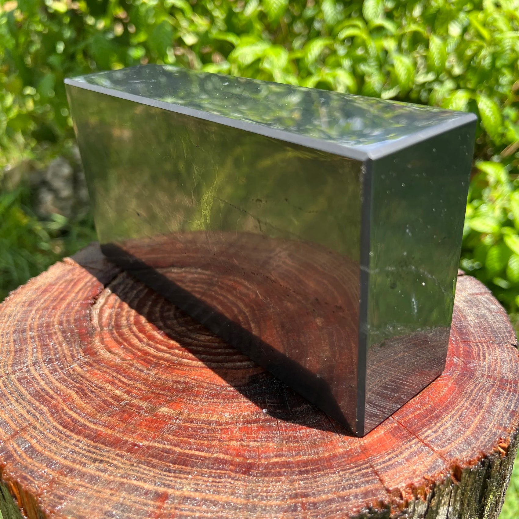 Edge-on view of Shungite polished block, from Republic of Karélia, Russia, showing natural variation.