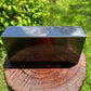 Top-down shot of Shungite polished block, traditionally used for Protection, sourced from Russia.