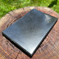 Top angle of Shungite polished slab, showing earthy tone, to support Protection.