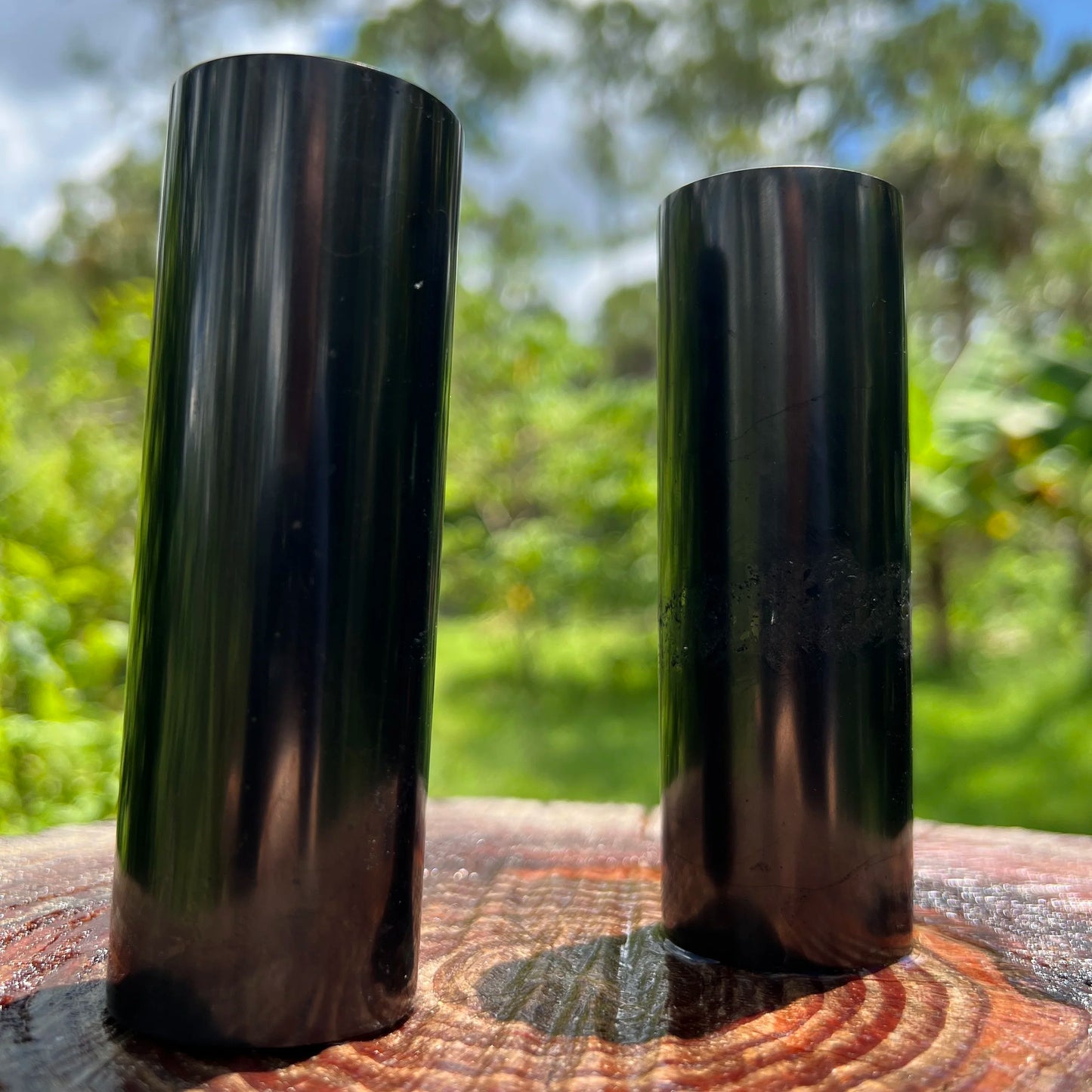 Sideways view of Shungite polished cylinder, sourced from Russia.