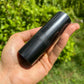 Holding a Shungite stone, from Republic of Karélia, Russia, with surface texture in view.
