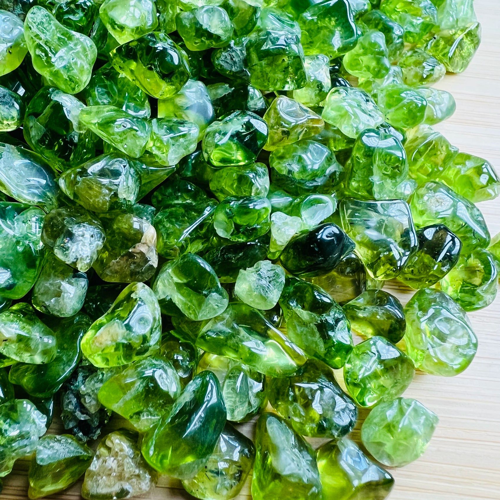 Top angle of Peridot tumbled stone, from San Carlos Apache Reservation, Arizona, United States, often paired with practices.