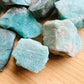 Edge view of Grade A Amazonite raw stone, showing natural inclusions.