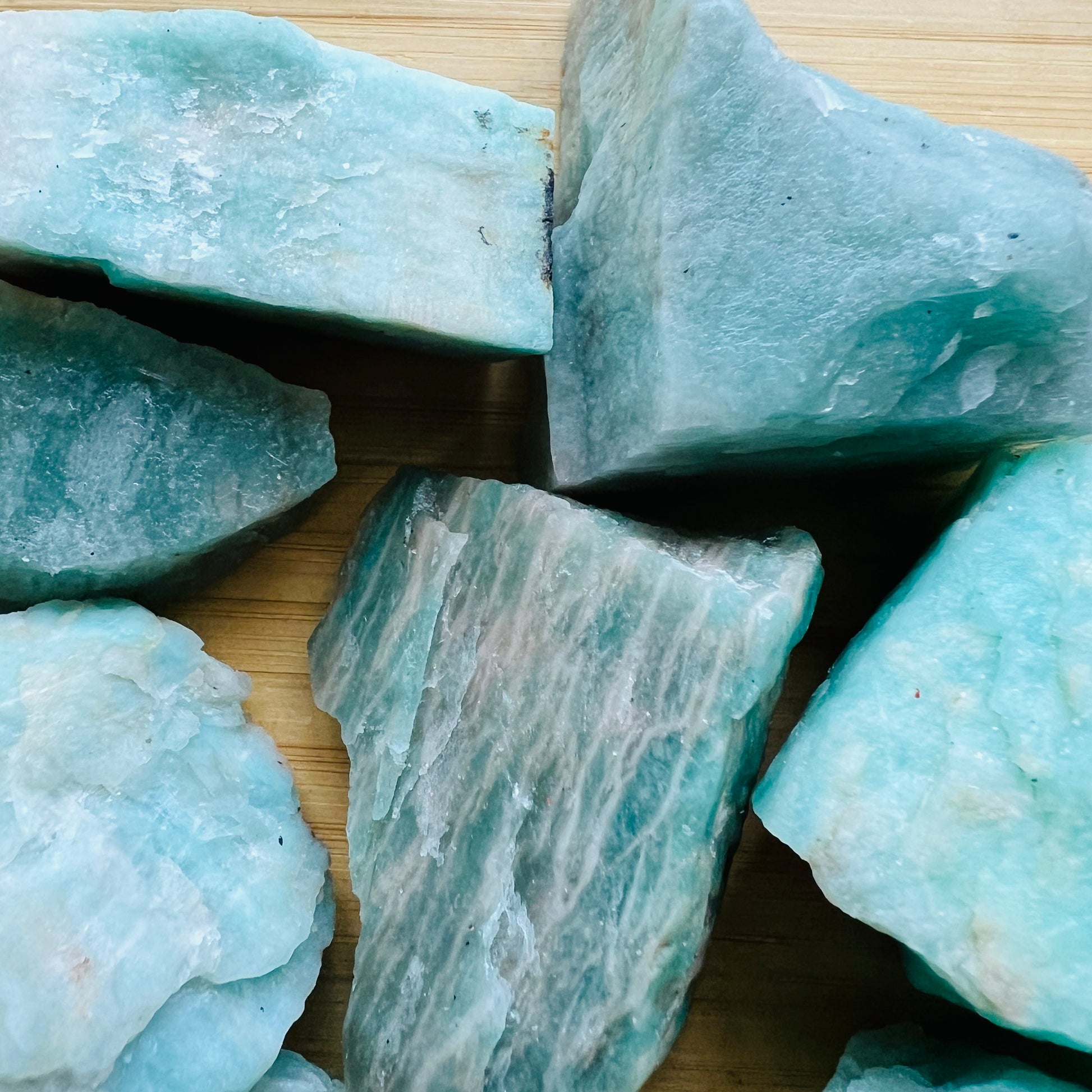 Palm-scale view of a Amazonite raw stone to support Stress Relief, sourced from Minas Gerais, Brazil.