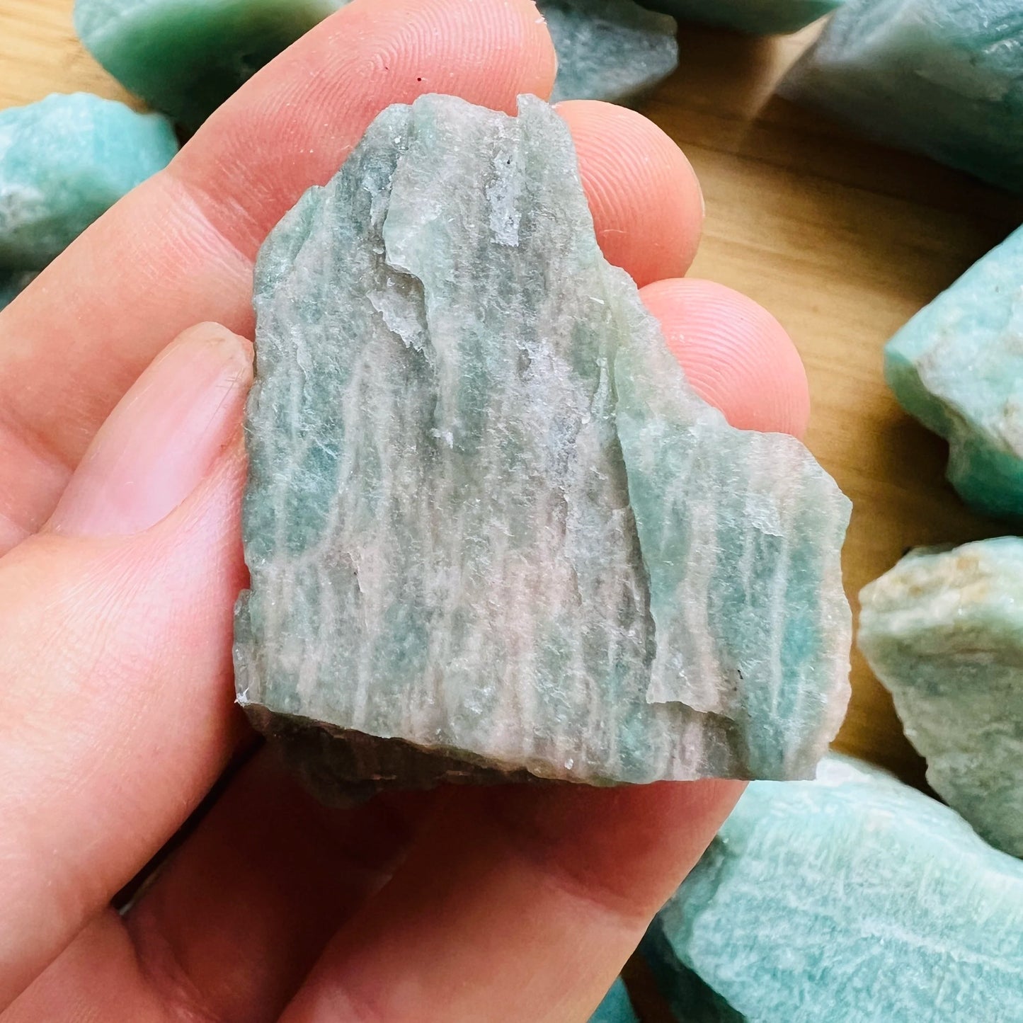 Back view of Grade A Amazonite raw showing natural surface