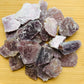 Detail capture of Grade AA Lepidolite raw stone, from Minas Gerais, Brazil.