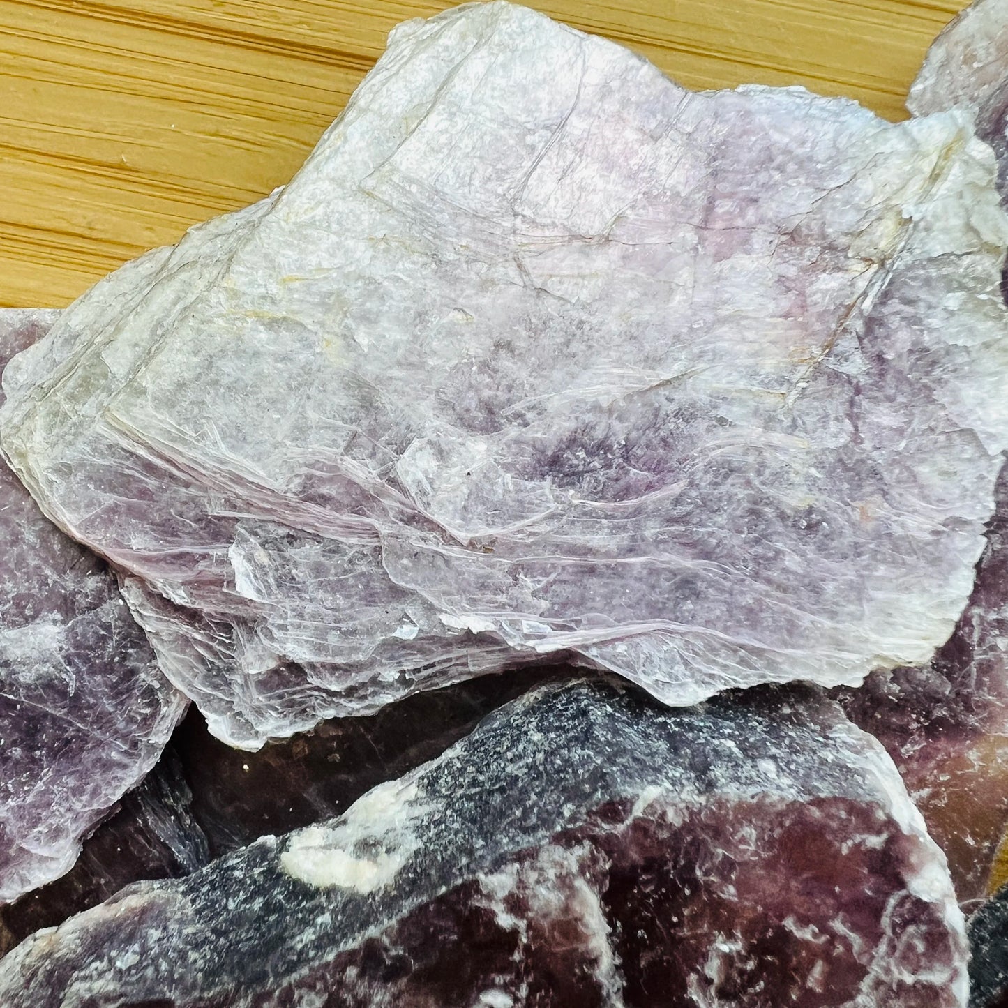 Reverse angle of Lepidolite raw stone, showing tight grain, to support Stress Relief.