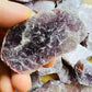 Back view of Grade AA Lepidolite raw showing natural surface