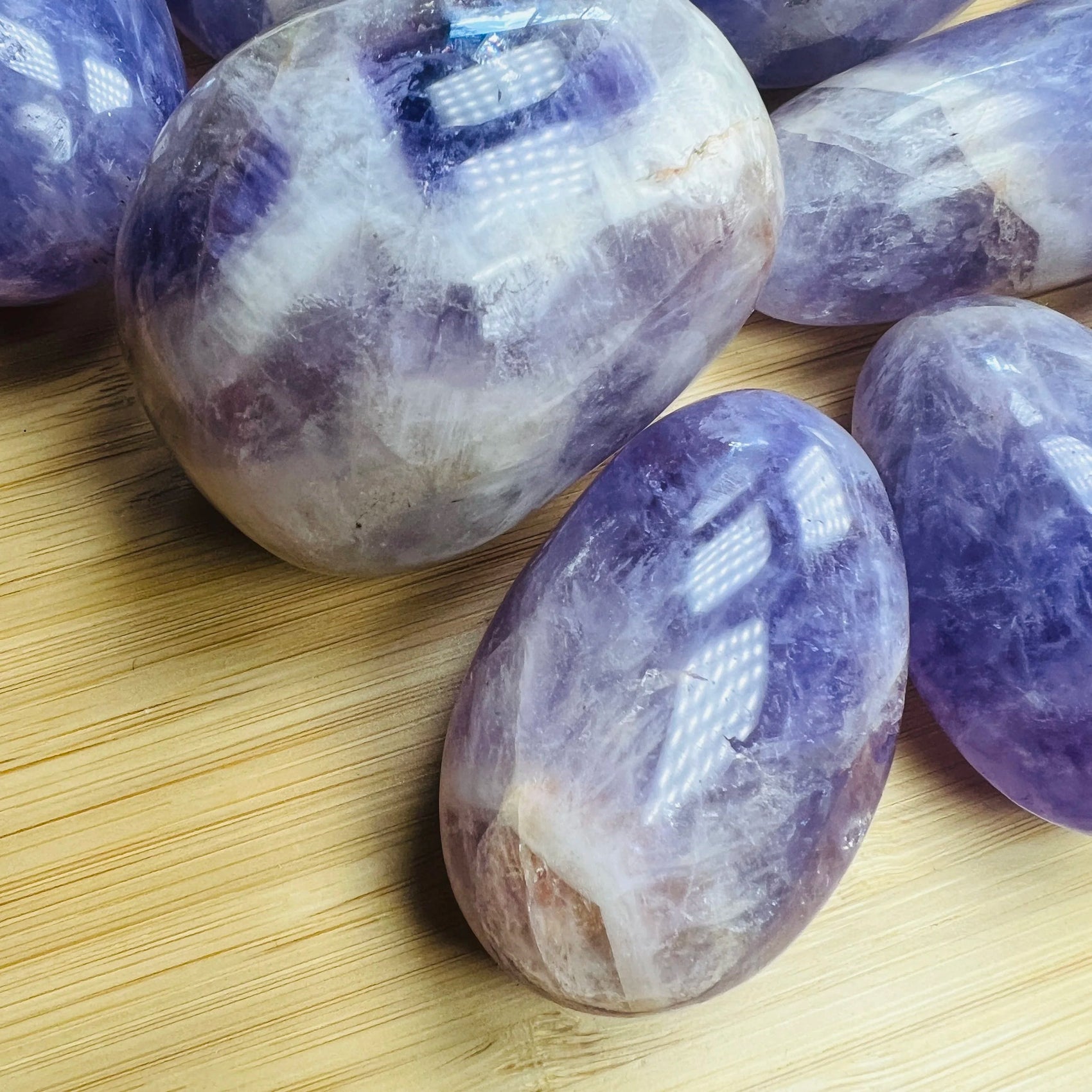 Profile shot of Banded Amethyst palm stone, sourced from Ambatondrazaka, Madagascar, showing natural sheen.