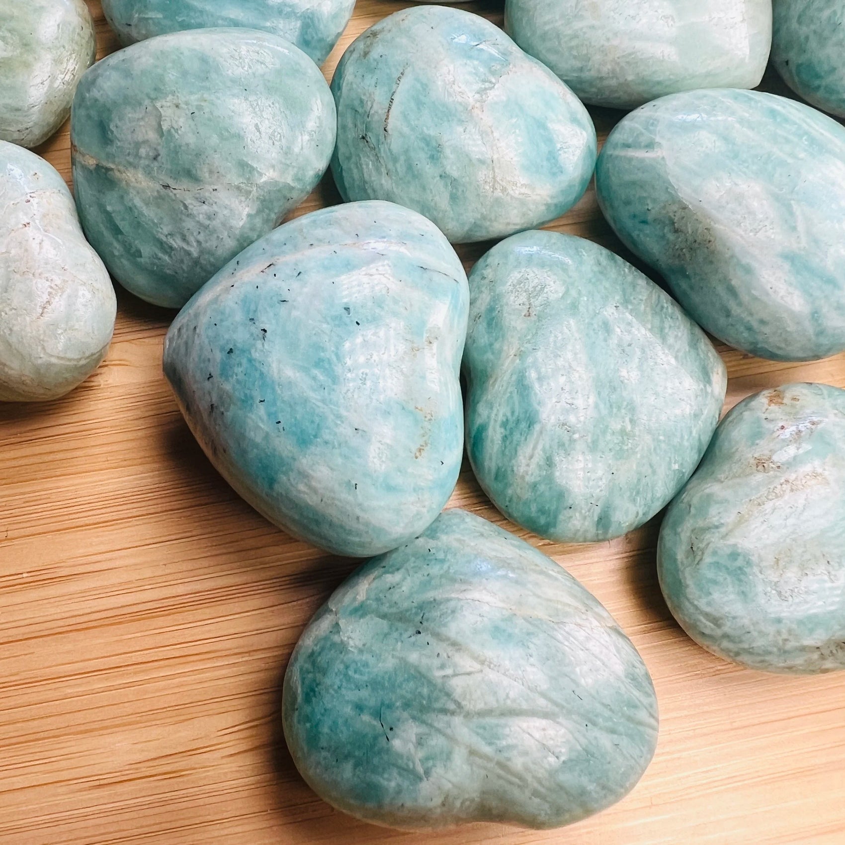 Close-up of Amazonite heart carving from Madagascar, soothing wellness stone for Emotional Healing