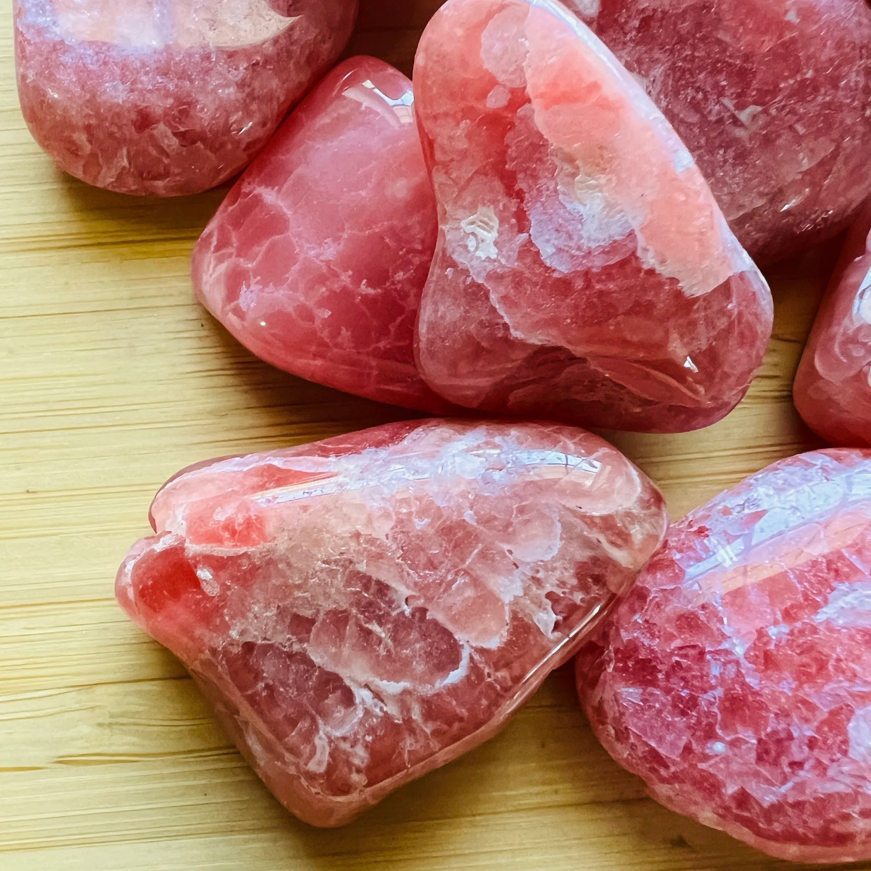 Overhead angle of Rhodochrosite tumbled stone, often paired with practices around Emotional Healing and Love.