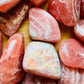 Size comparison with a Rhodochrosite tumbled stone, Argentina-sourced.