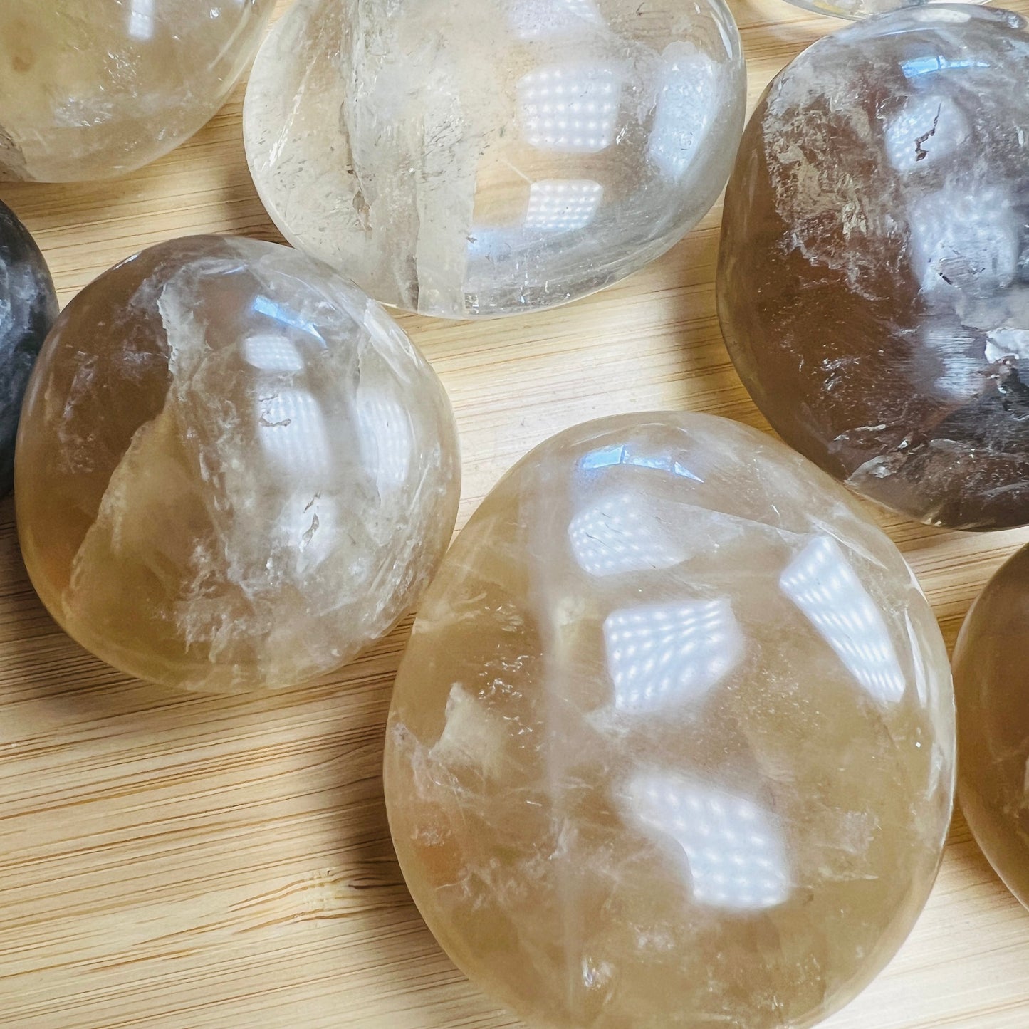 Detail of Natural Citrine palm stone, kept near for Abundance, sourced from Vakinankaratra, Madagascar.
