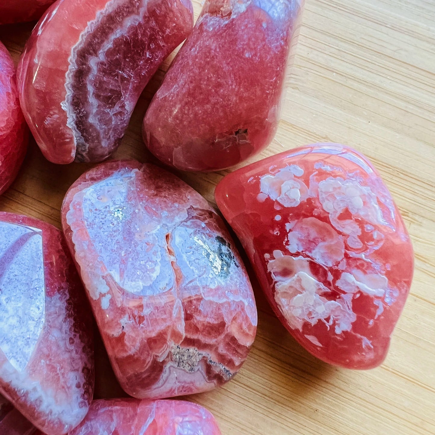 Full profile of Grade AA Rhodochrosite tumbled stone ready to ship from Beyond Bohemian