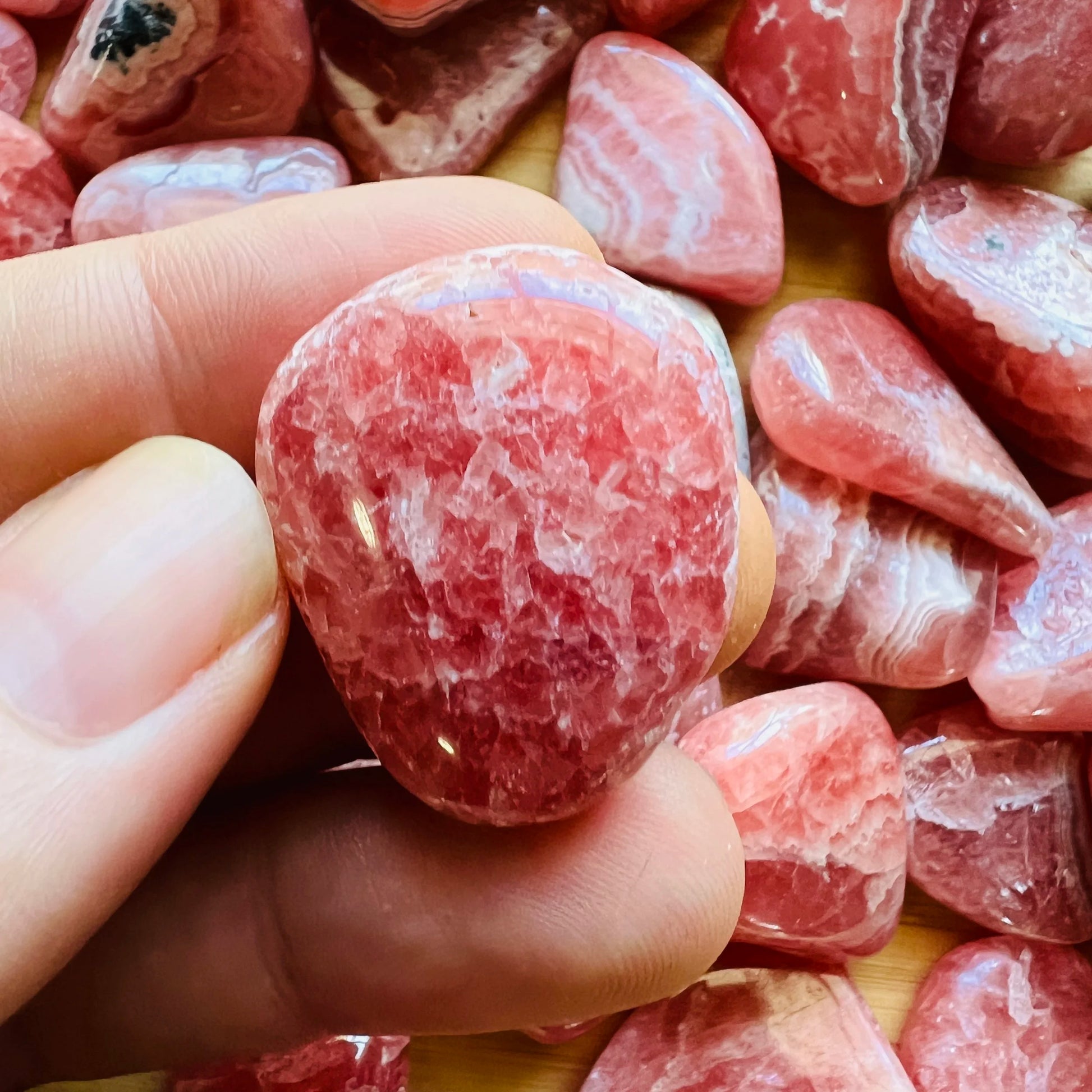Full profile of Grade AA Rhodochrosite tumbled stone ready to ship from Beyond Bohemian