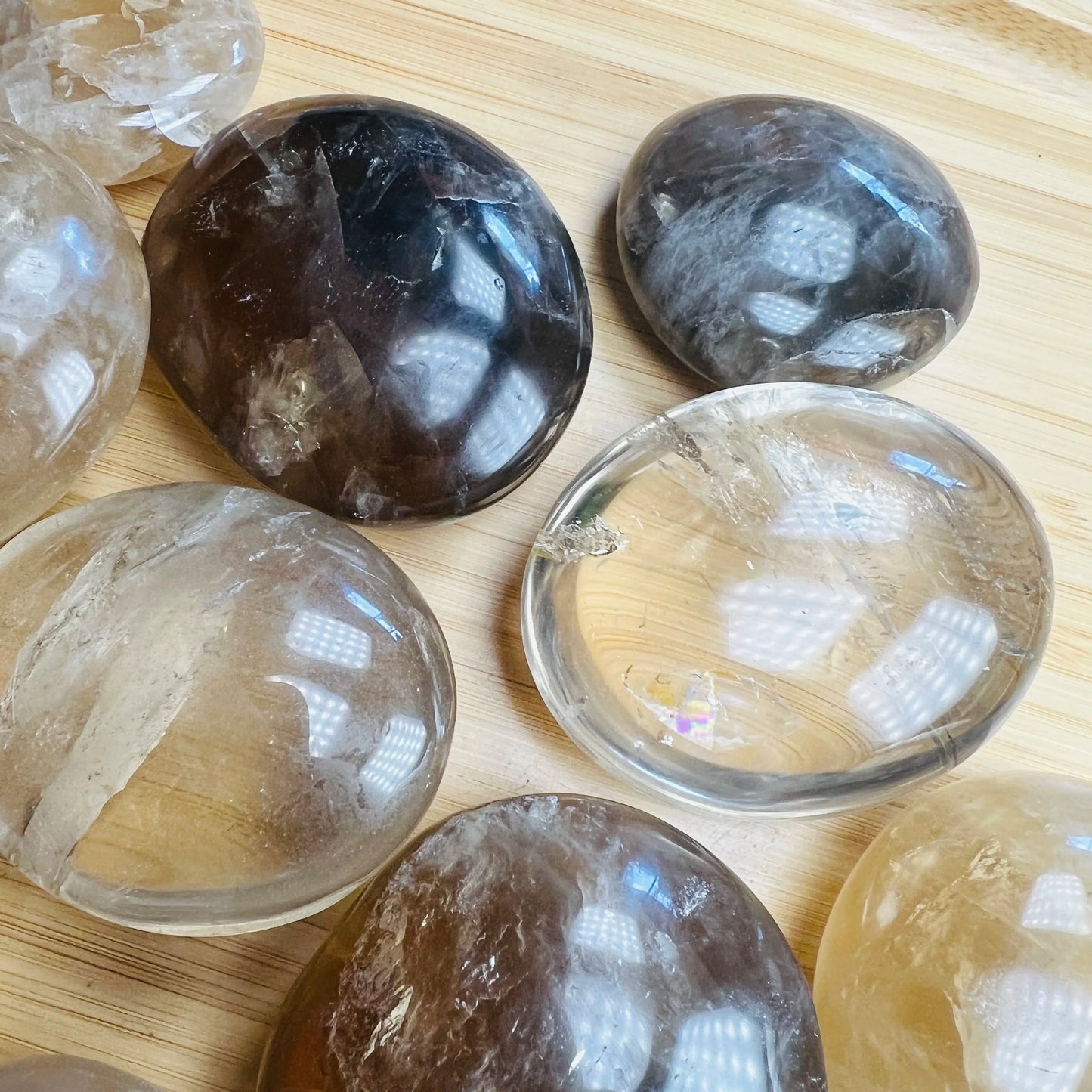 Overhead angle of Grade A Natural Citrine palm stone, Madagascar-sourced, showing color depth.