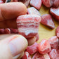 Full profile of Grade AA Rhodochrosite tumbled stone ready to ship from Beyond Bohemian
