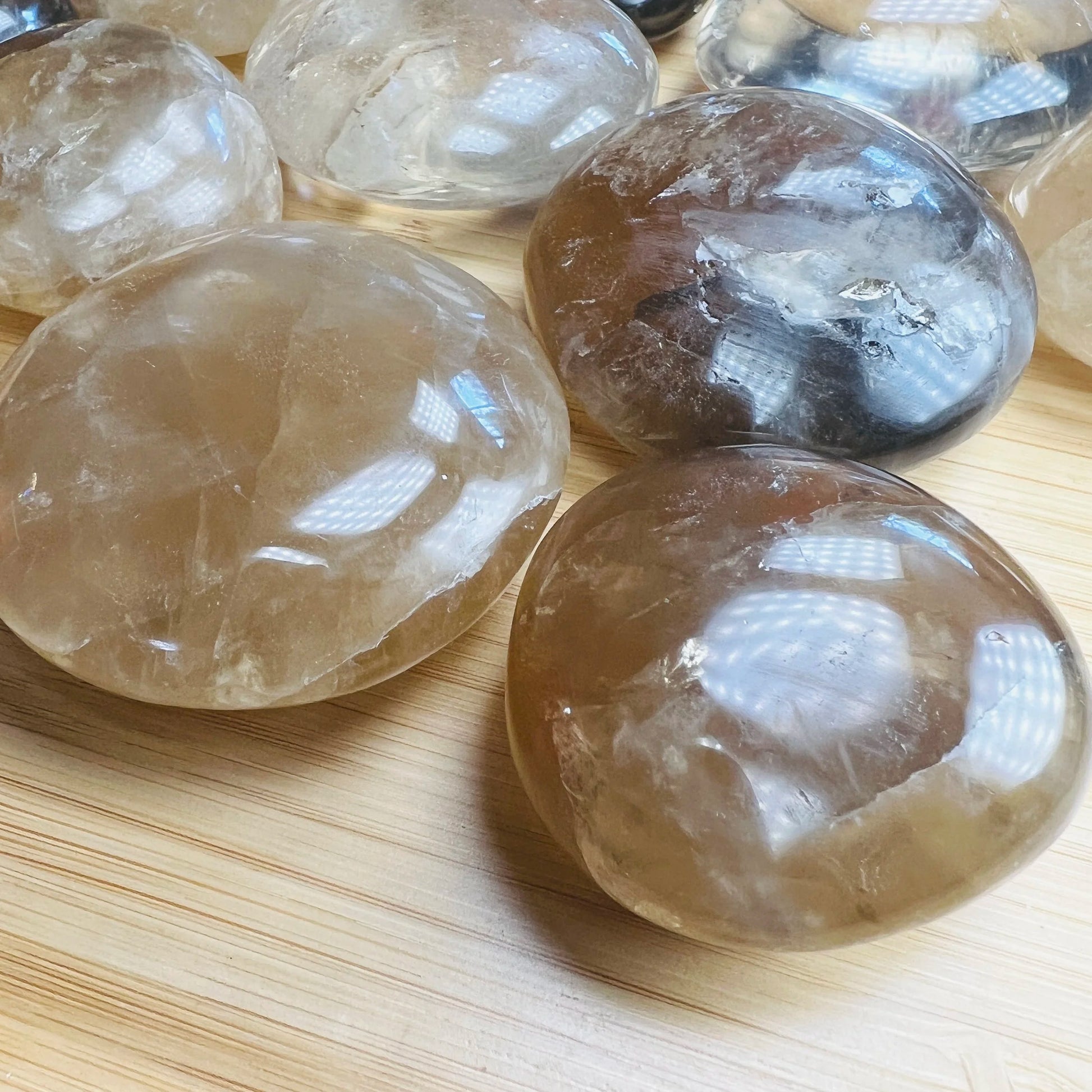 Reverse side of Natural Citrine palm stone, showing characteristic finish.