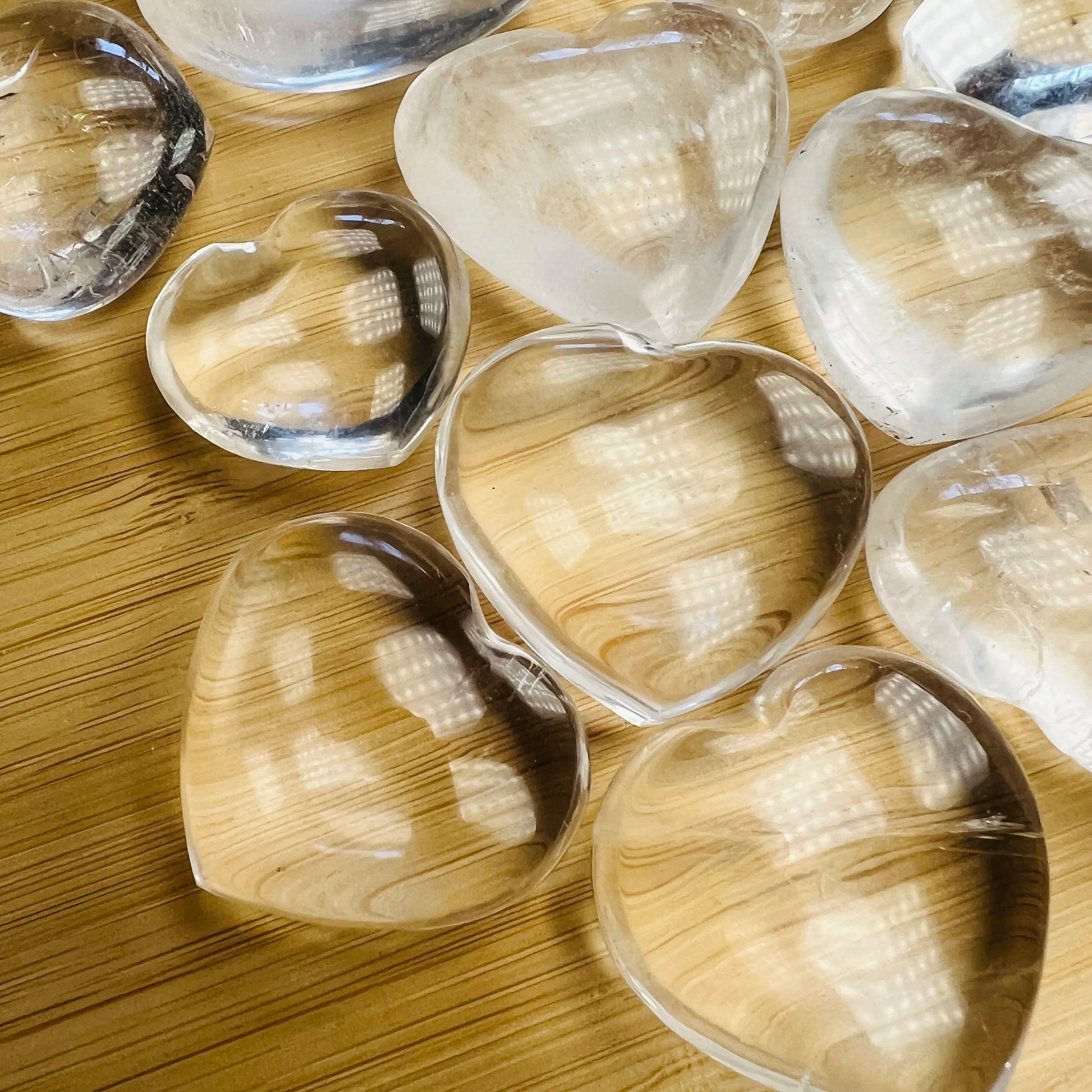 Hand-scale shot of a Clear Quartz polished heart, hand-selected from Vakinankaratra, Madagascar.