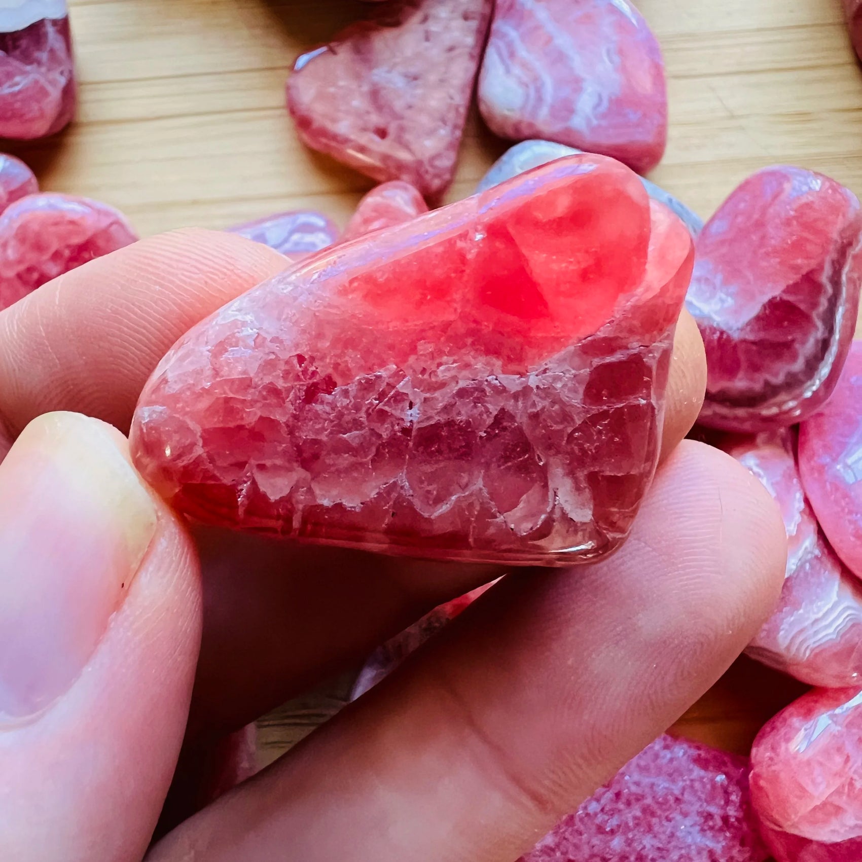 Full profile of Grade AA Rhodochrosite tumbled stone ready to ship from Beyond Bohemian