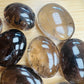 Reverse side of Smoky Quartz palm stone, showing earthy tone.