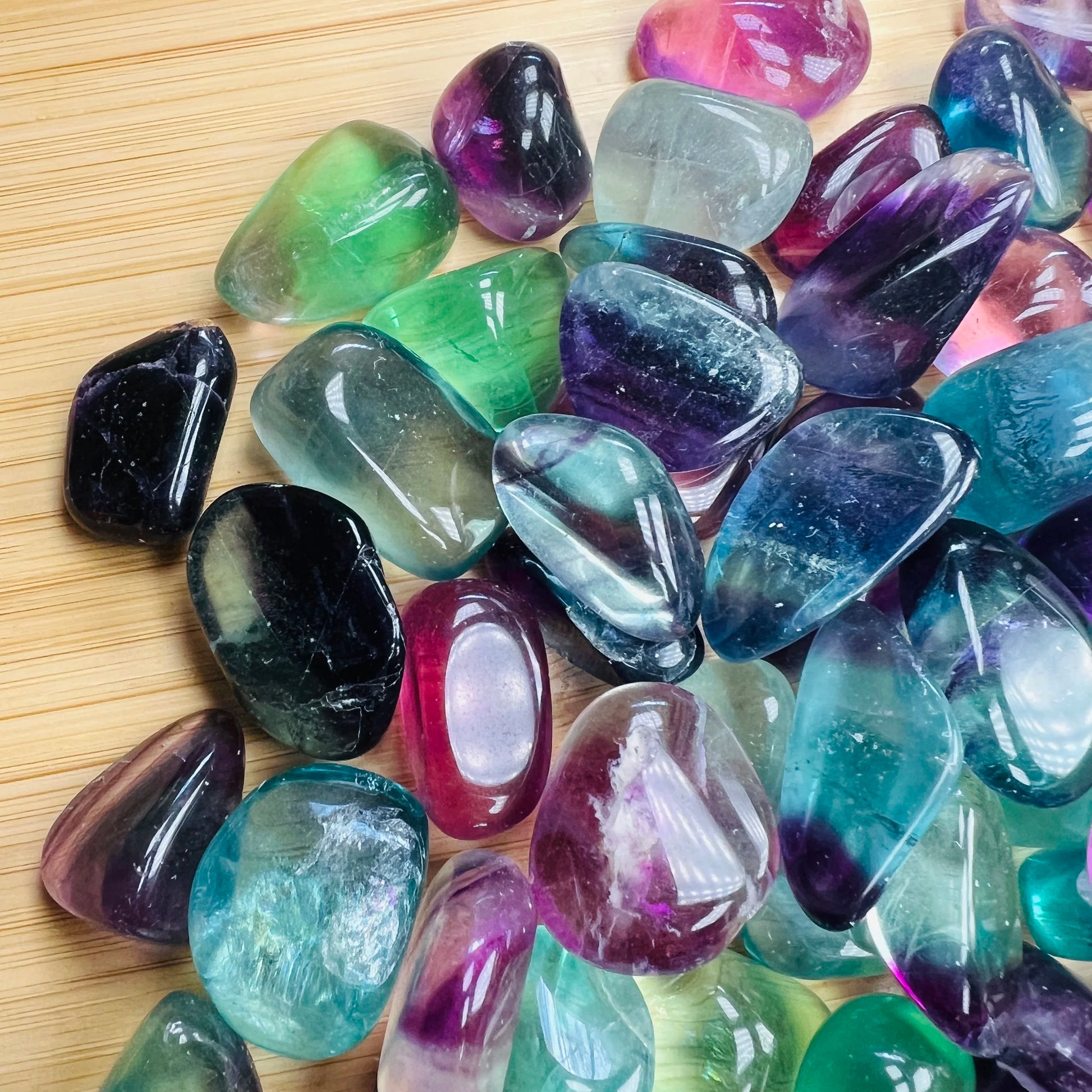 Edge view of Fluorite tumbled stone, worked with for Focus and Meditation.