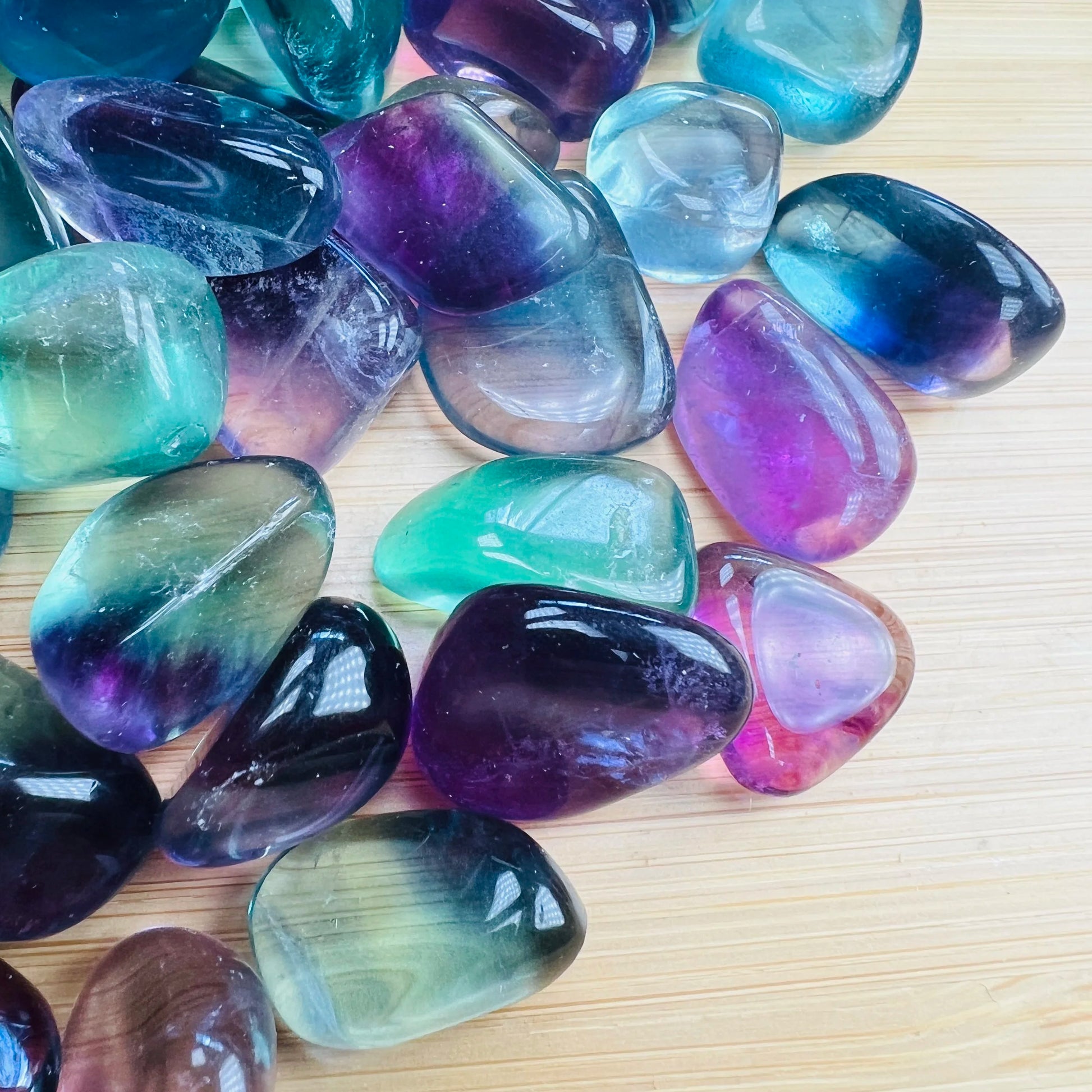 Reverse side of Fluorite tumbled stone, showing soft luster.