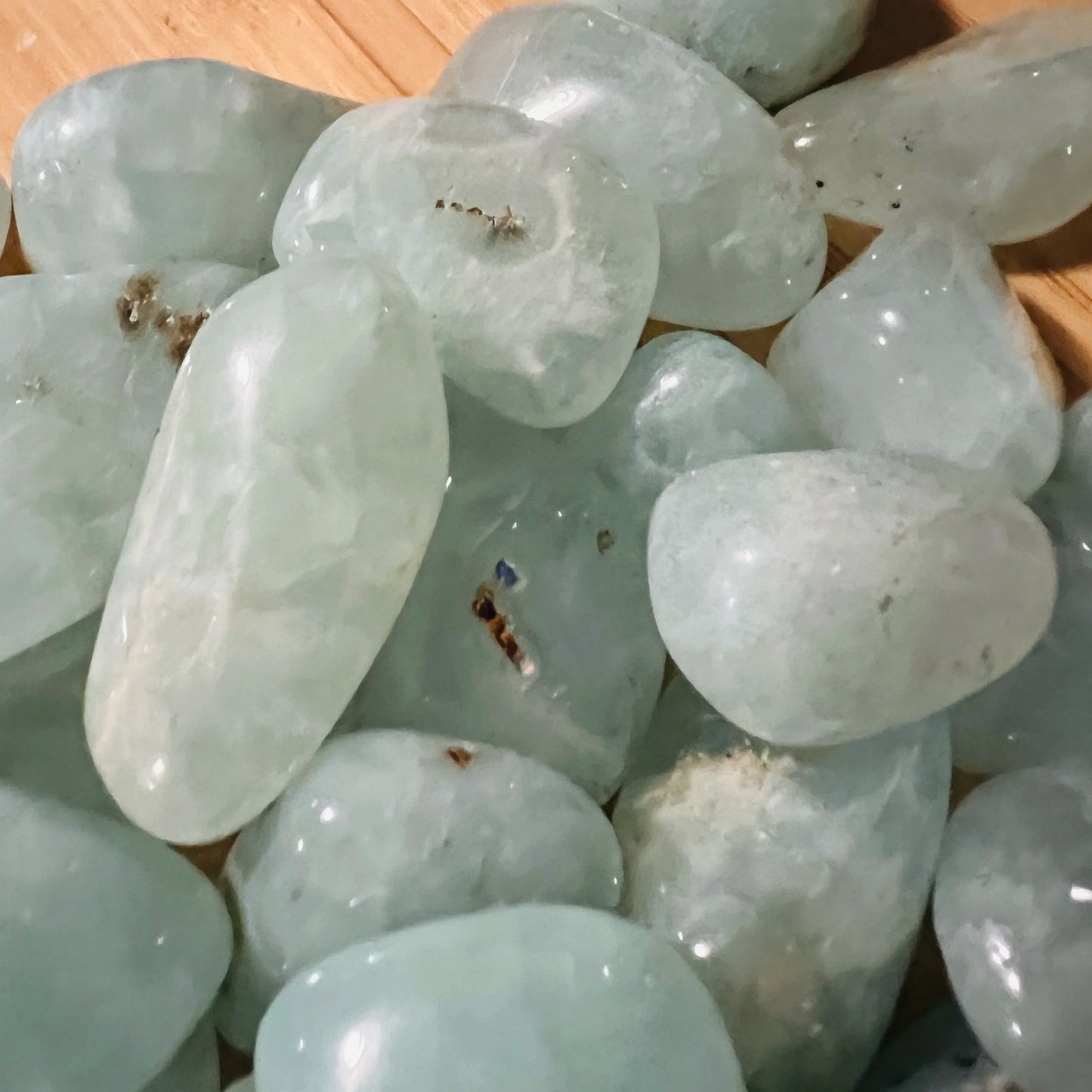 Overhead angle of Prehnite tumbled stone, to support Healing and Meditation.