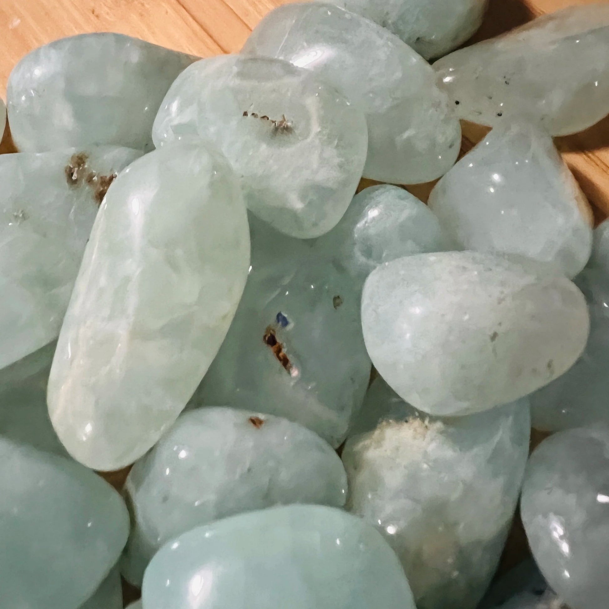 Overhead angle of Prehnite tumbled stone, to support Healing and Meditation.