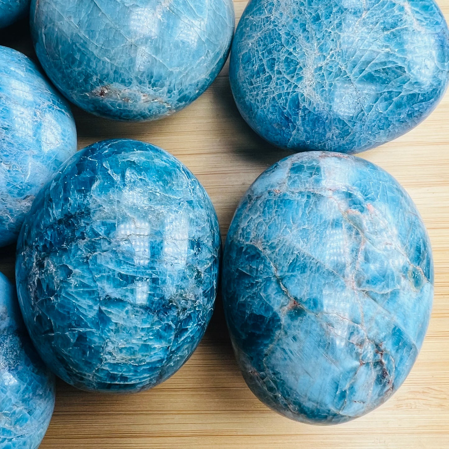Overhead angle of Apatite palm stone, showing glassy finish.