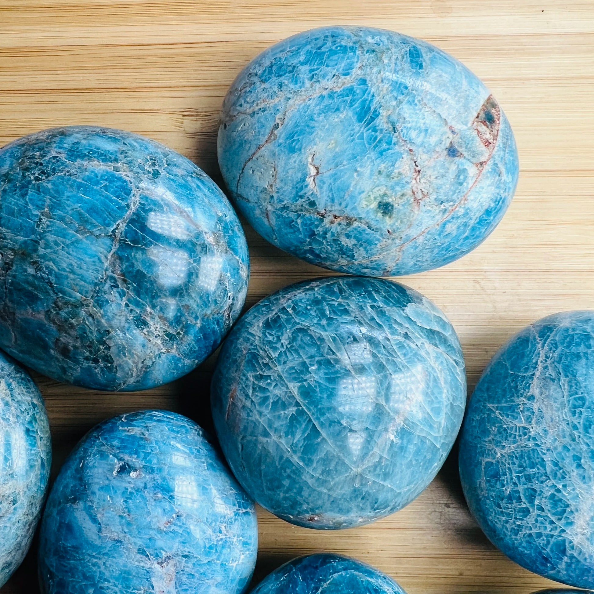 Alternate angle of Apatite palm stone, showing natural variation, sourced from Madagascar.