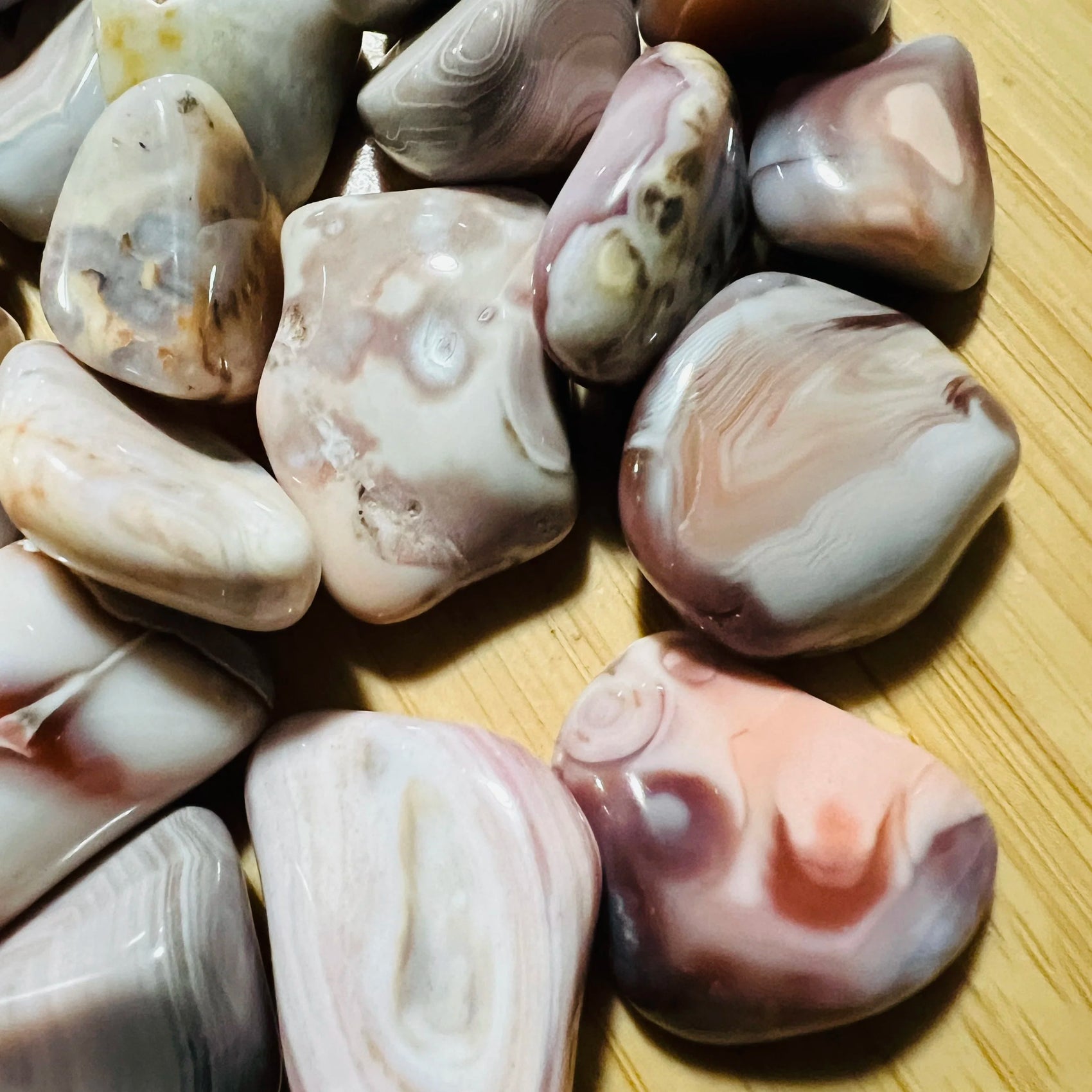 Underside detail of Pink Agate tumbled stone, from Botswana, carried for Love and Self Love.